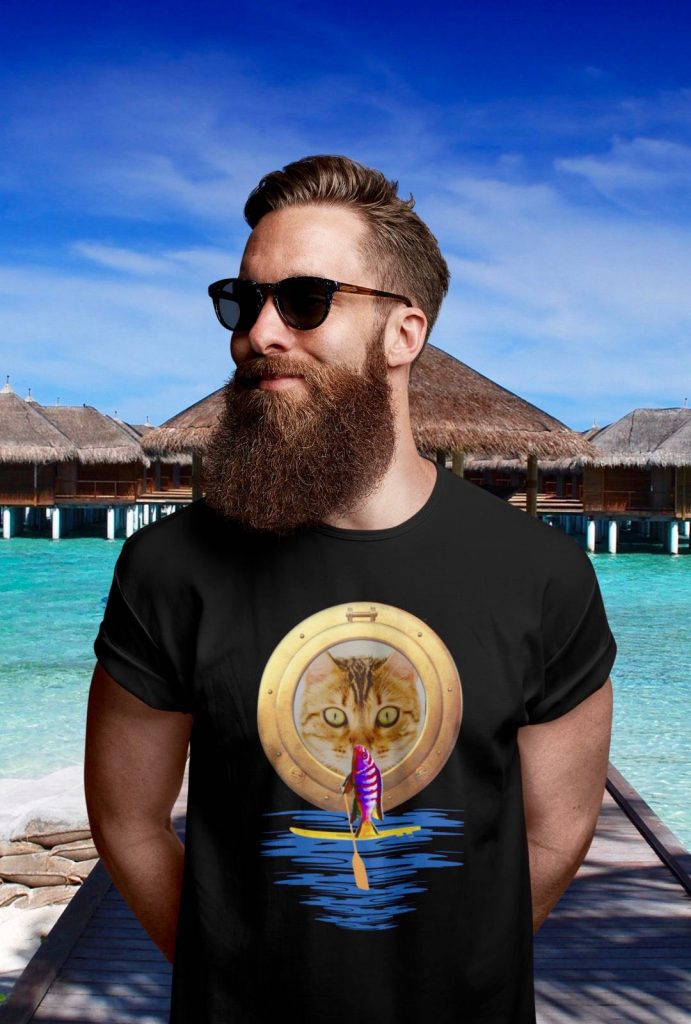 Cool man with a beard and black t-shirt. Funny, cute cat is watching stand up paddle fish on SUP gift present idea