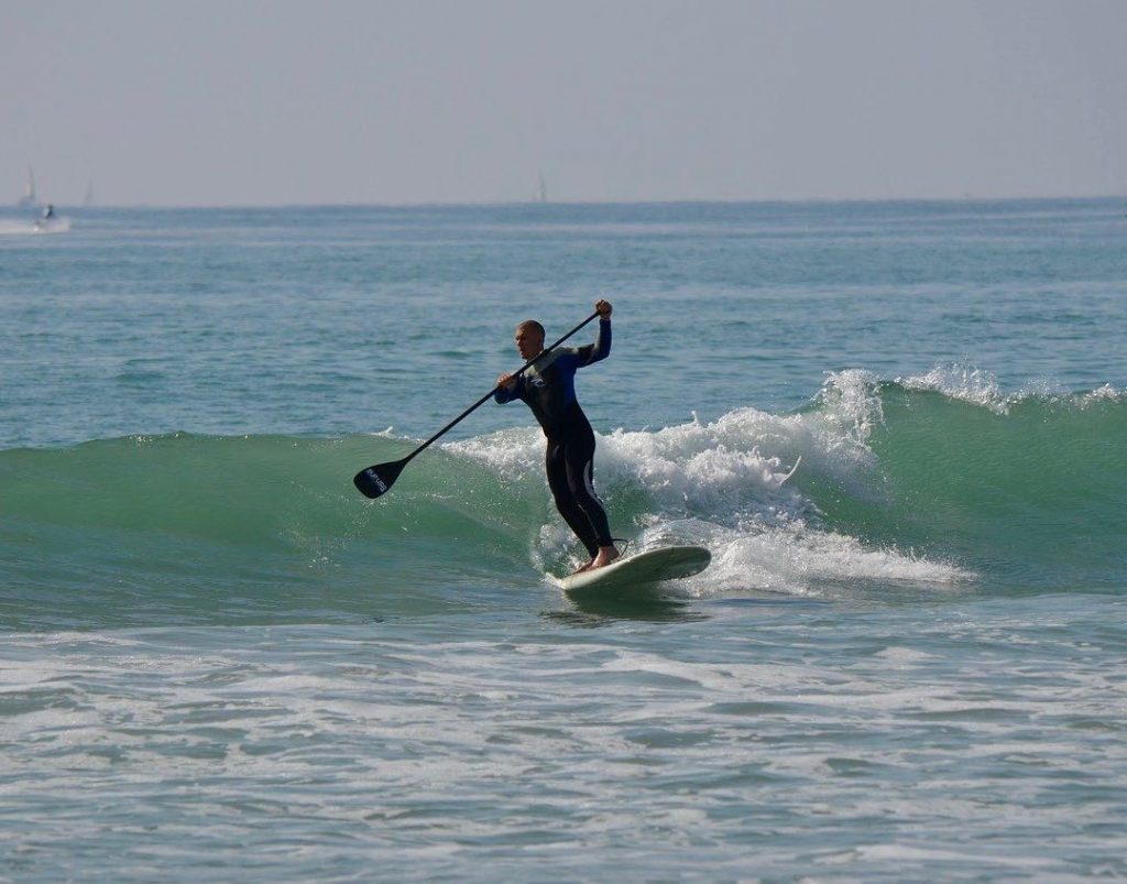 Surfing with Paddleboard. SUP surfing 