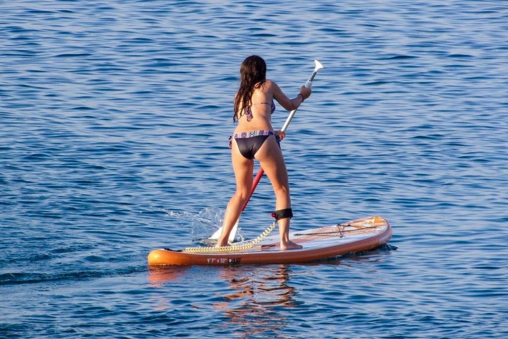 Paddleboarding woman on SUP Board